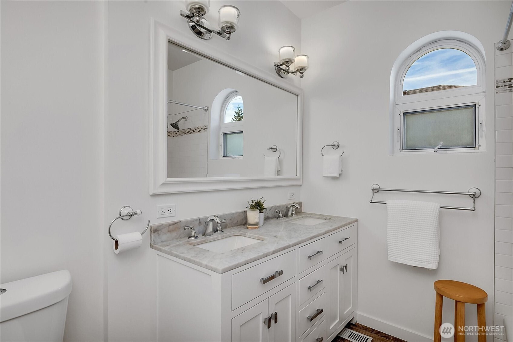 321 West Garfield Street Seattle, WA 98119 - Photo 20 of 31 a bathroom with a sink vanity and a mirror