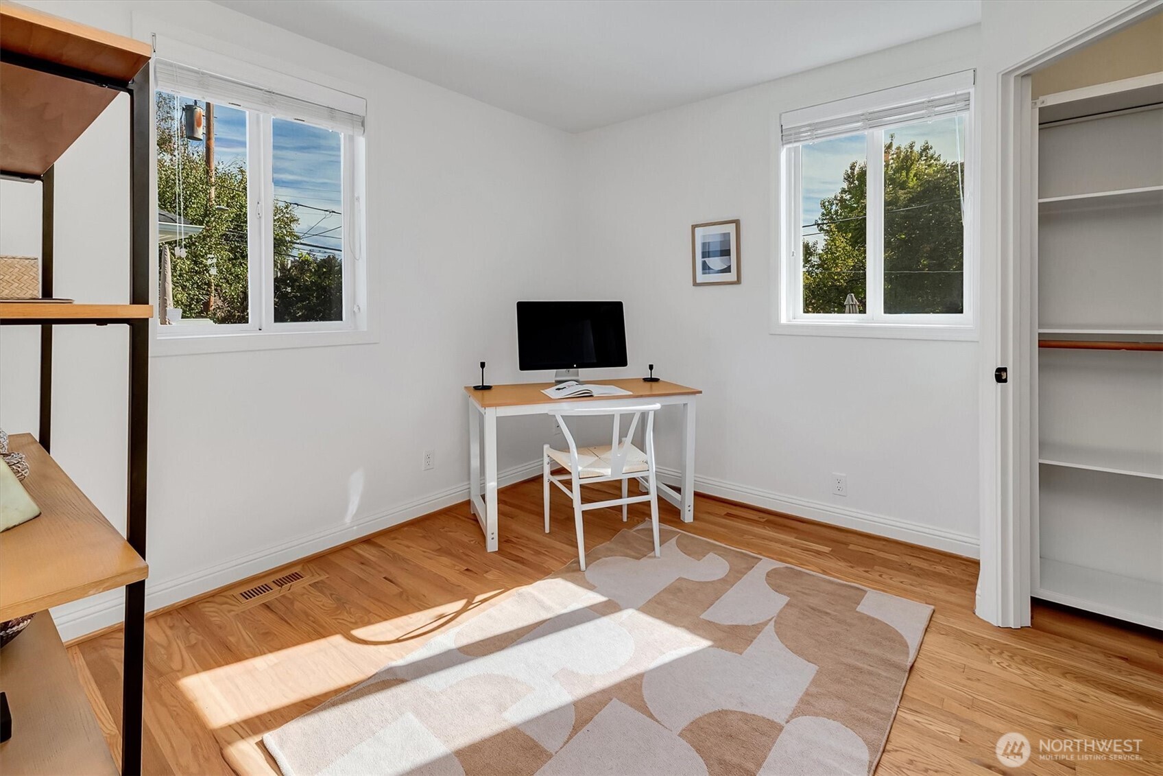 321 West Garfield Street Seattle, WA 98119 - Photo 22 of 31 a workspace with wooden floor and a window