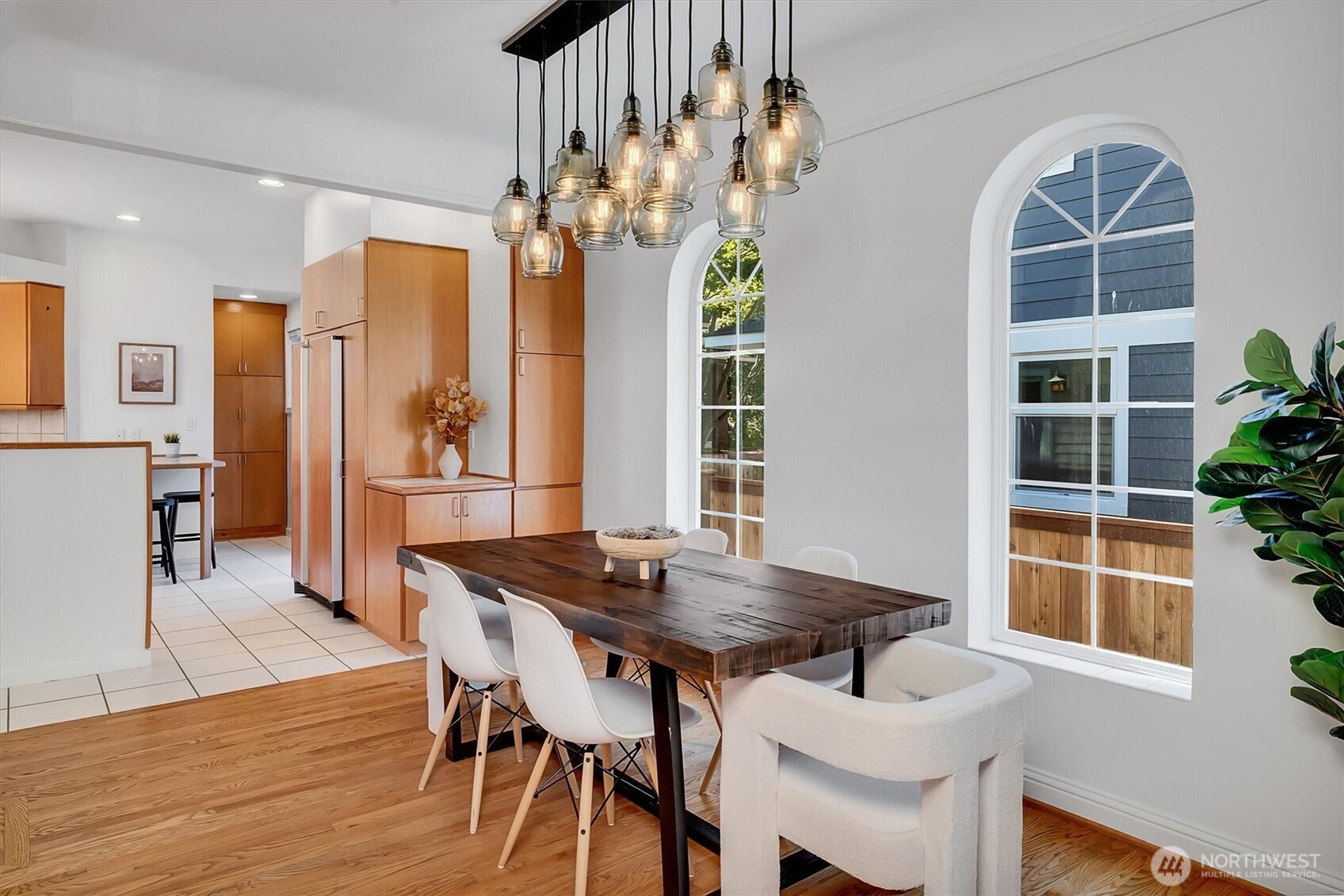 321 West Garfield Street Seattle, WA 98119 - Photo 8 of 31 a view of a dining room with furniture window and wooden floor