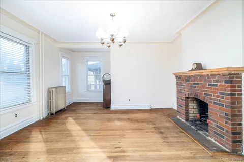 a view of empty room with a fireplace