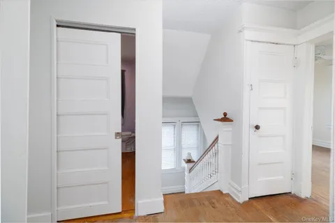 a view of entryway with stairs and wooden floor