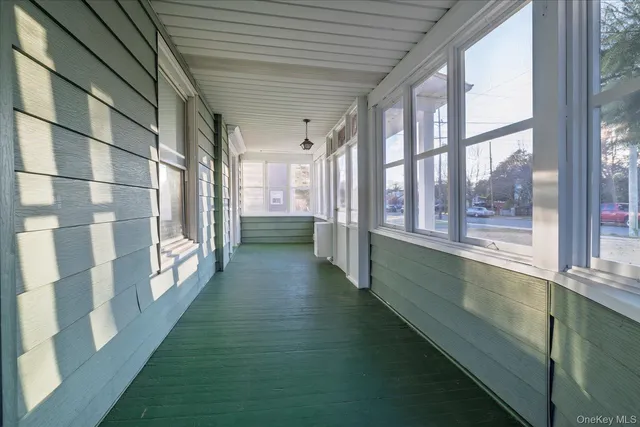 a view of a porch with a large window