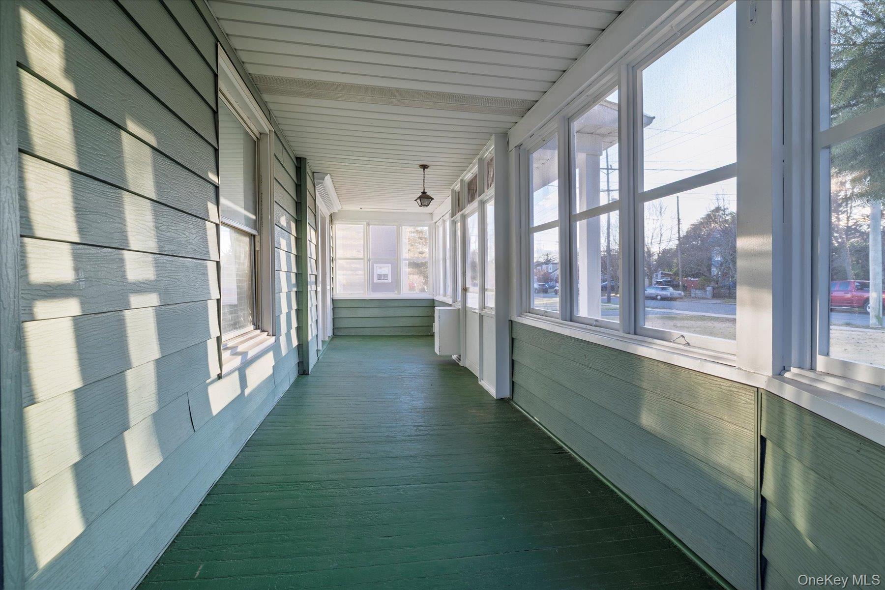 2483 Central Avenue Baldwin, NY 11510 - Photo 7 of 28 a view of a porch with a large window