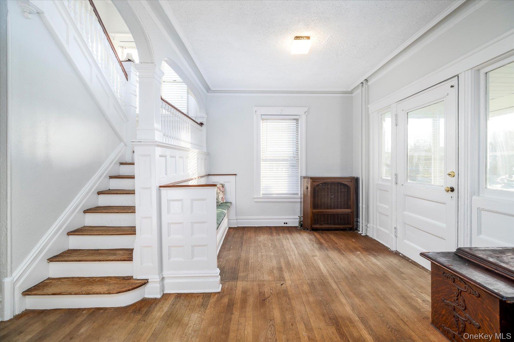2483 Central Avenue Baldwin, NY 11510 - Photo 8 of 28 a view of entryway with wooden floor and stairs