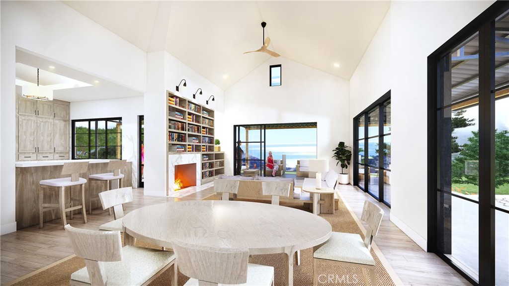 a living room with furniture a dining table and a large window