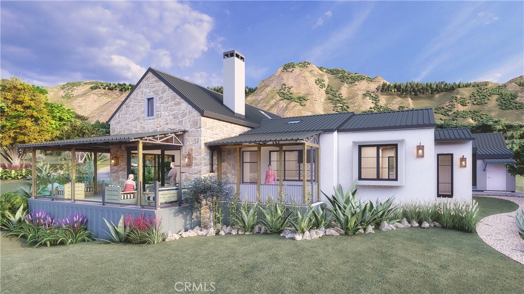 27152 Carrita Road Malibu, CA 90265 - Photo 2 of 9 front view of a house with a yard