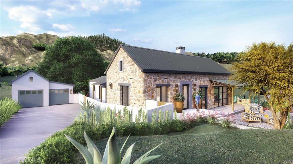 27152 Carrita Road Malibu, CA 90265 - Photo 8 of 9 a front view of a house with a yard