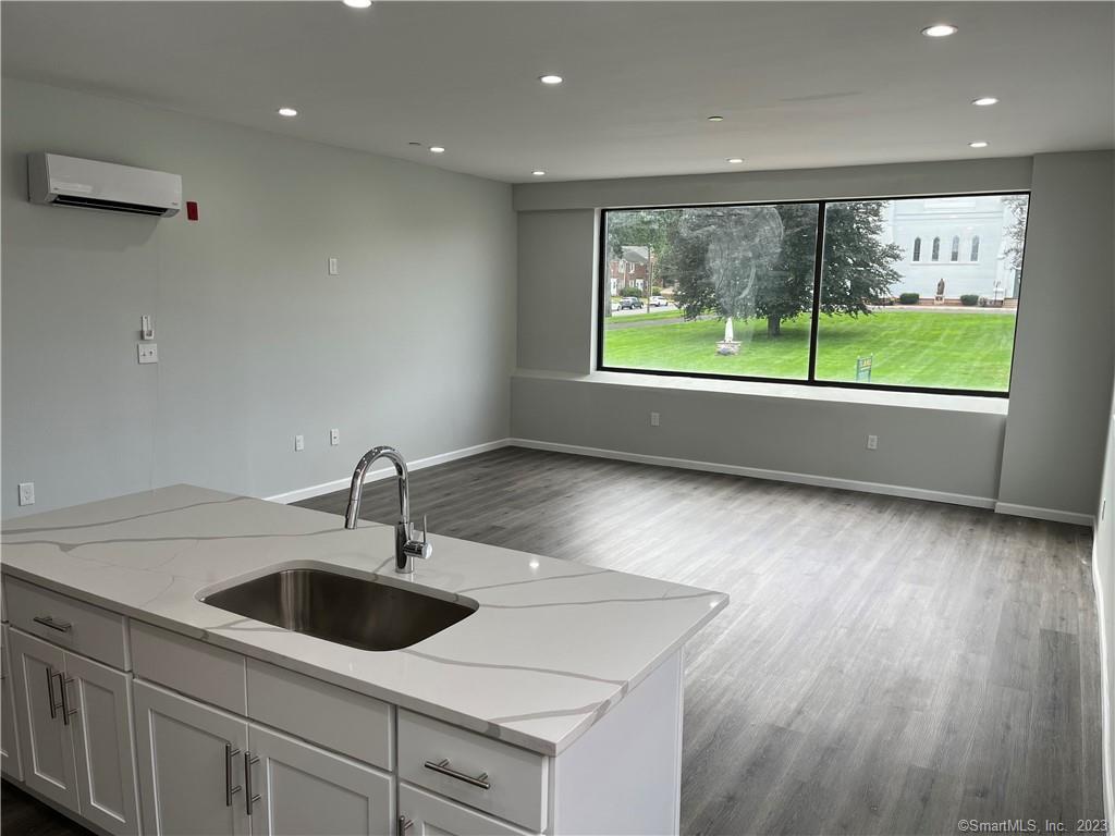 893 Main Street, Unit 202 Manchester, CT 06040 - Photo 3 of 10 a kitchen with a sink and large window