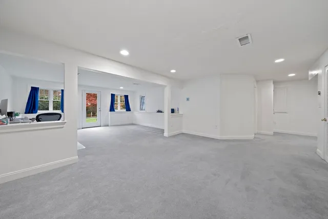 a view of a livingroom with kitchen and furniture