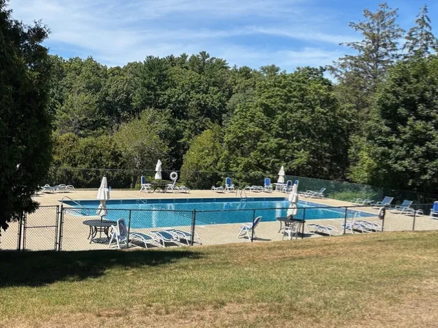 a view of a swimming pool with a chair