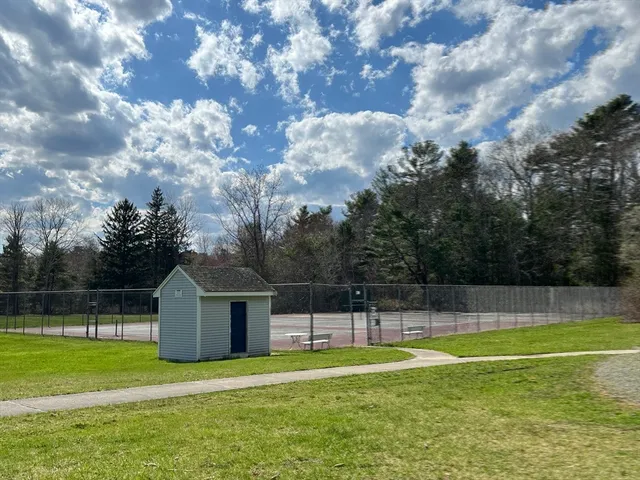a view of a house with a backyard