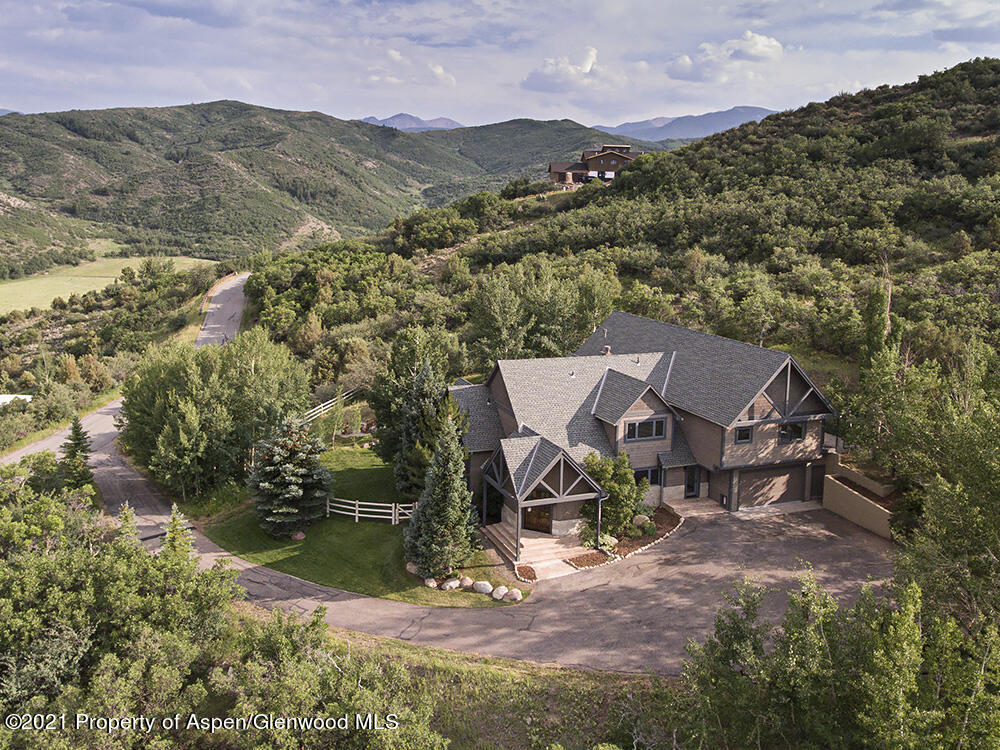 400 Medicine Bow Road Aspen, CO 81611 - Photo 1 of 58 an aerial view of a house with a yard