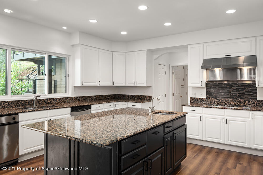 400 Medicine Bow Road Aspen, CO 81611 - Photo 14 of 58 a kitchen with granite countertop a sink and a stove