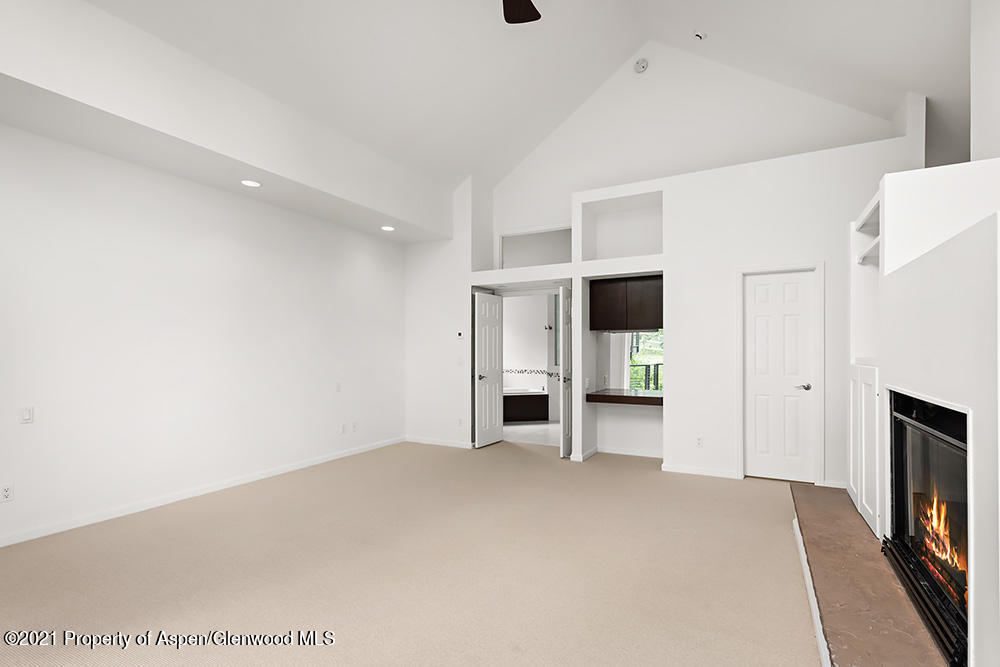 400 Medicine Bow Road Aspen, CO 81611 - Photo 17 of 58 a view of a livingroom with a fireplace