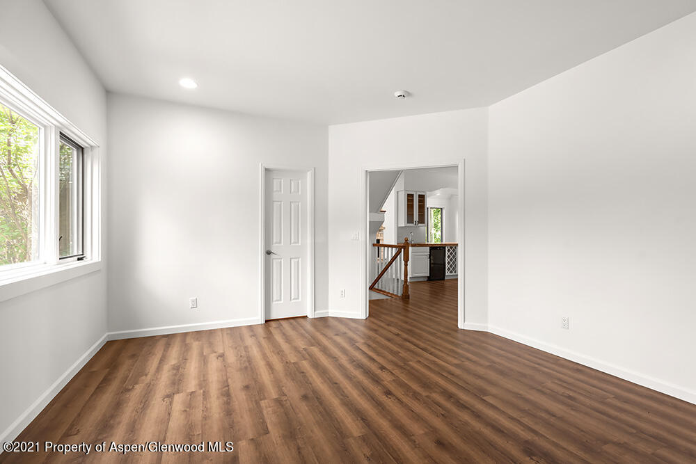 400 Medicine Bow Road Aspen, CO 81611 - Photo 20 of 58 a view of empty room with wooden floor