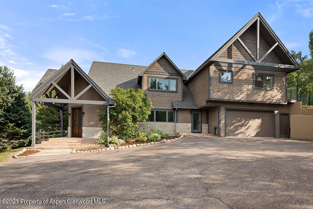 400 Medicine Bow Road Aspen, CO 81611 - Photo 2 of 58 a front view of a house with a yard