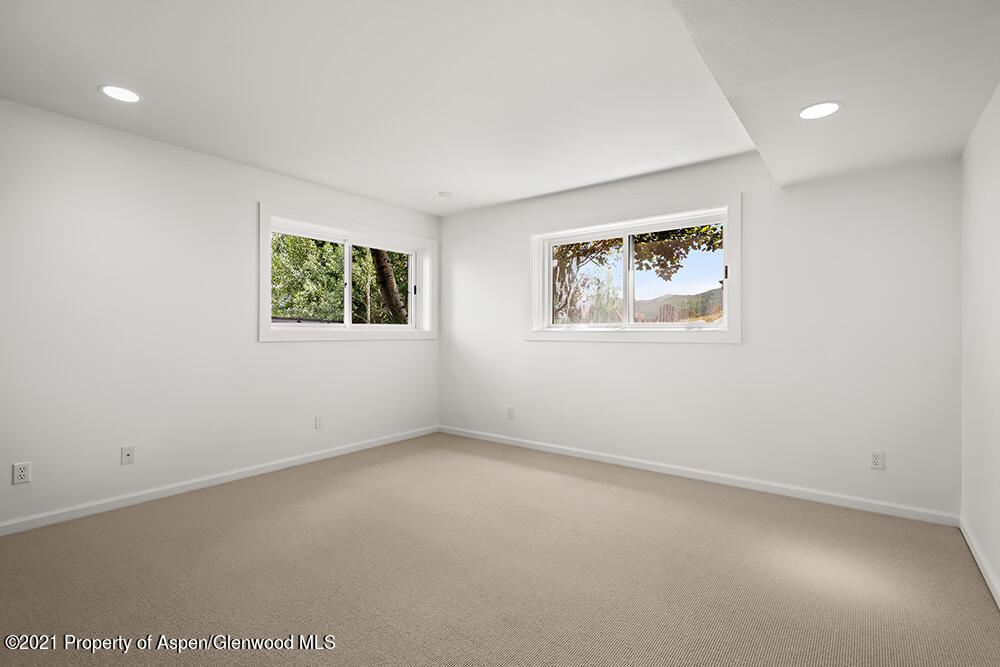 400 Medicine Bow Road Aspen, CO 81611 - Photo 23 of 58 an empty room with windows