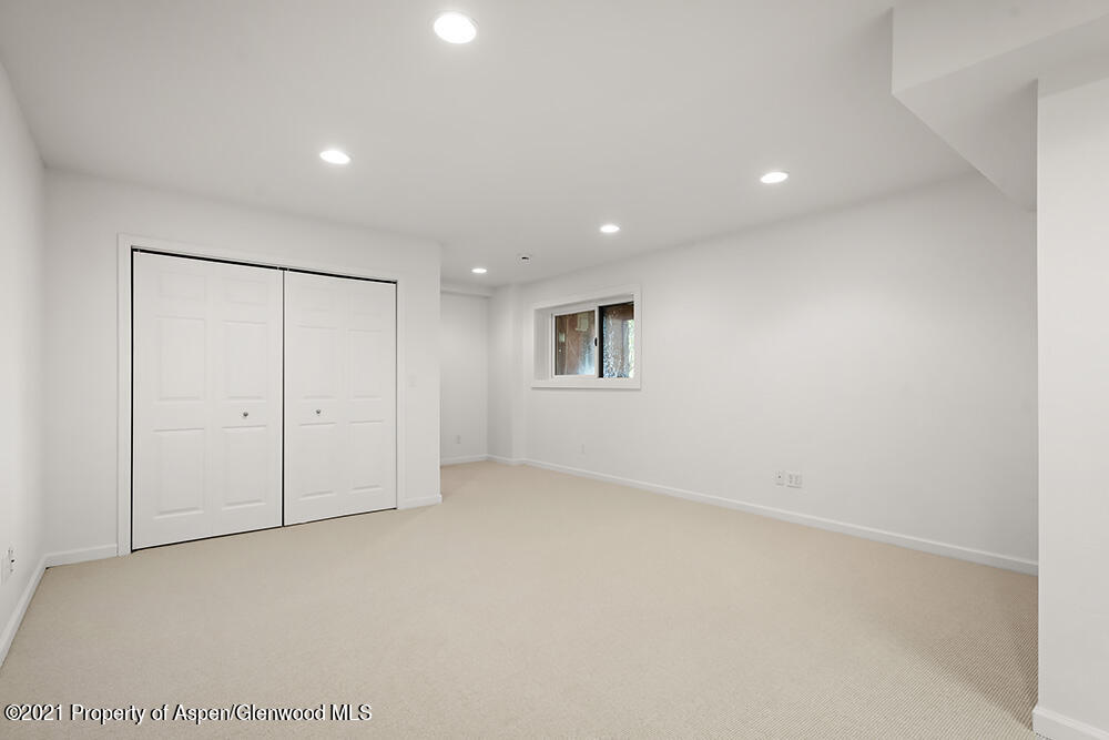 400 Medicine Bow Road Aspen, CO 81611 - Photo 26 of 58 an empty room with a empty space and windows