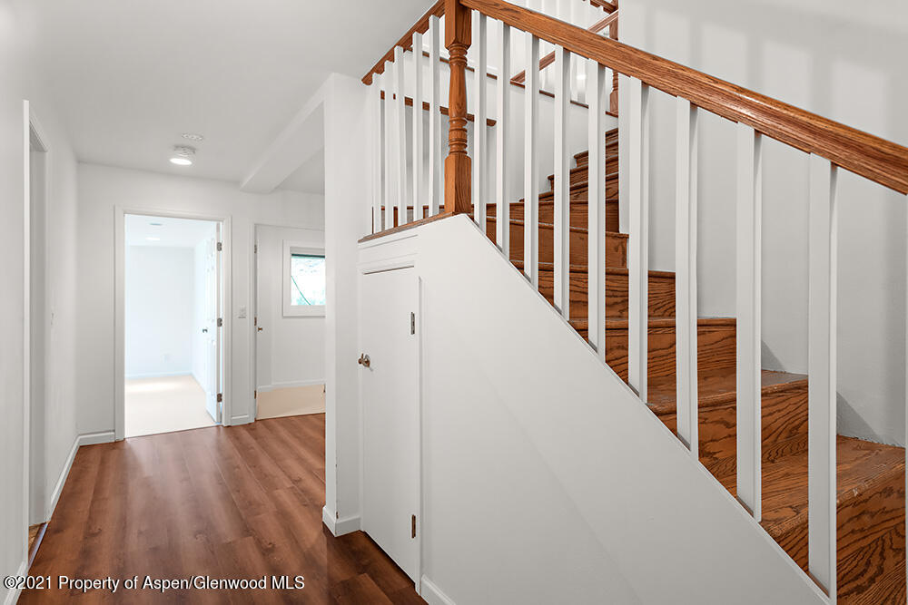 400 Medicine Bow Road Aspen, CO 81611 - Photo 32 of 58 a view of staircase with wooden floor and stairs