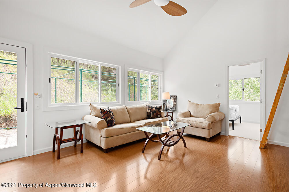 400 Medicine Bow Road Aspen, CO 81611 - Photo 34 of 58 a living room with furniture and a large window