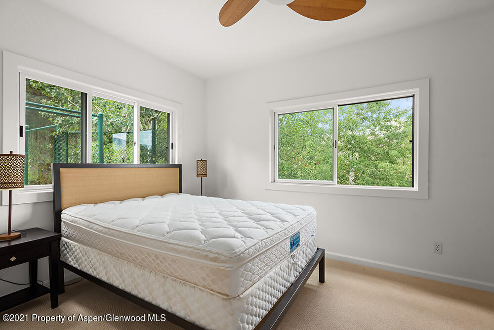 400 Medicine Bow Road Aspen, CO 81611 - Photo 38 of 58 a bedroom with a bed and window