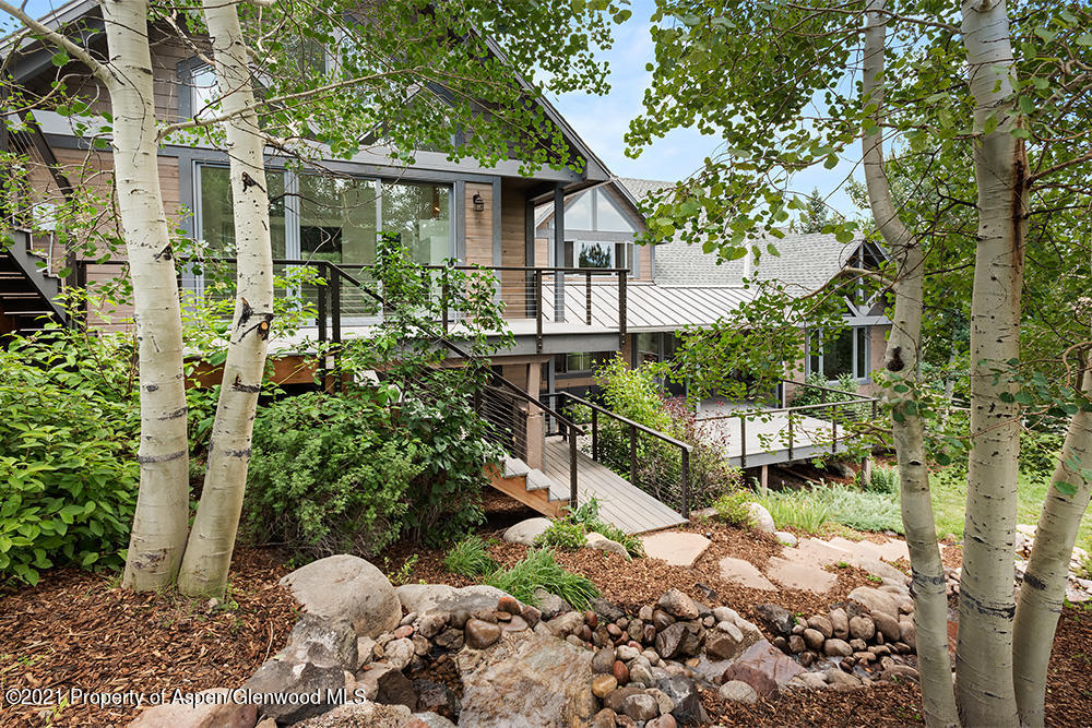 400 Medicine Bow Road Aspen, CO 81611 - Photo 4 of 58 a backyard of a house with lots of green space