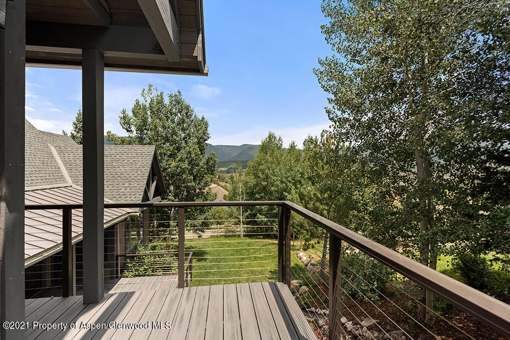 400 Medicine Bow Road Aspen, CO 81611 - Photo 44 of 58 a view of balcony with wooden floor and fence
