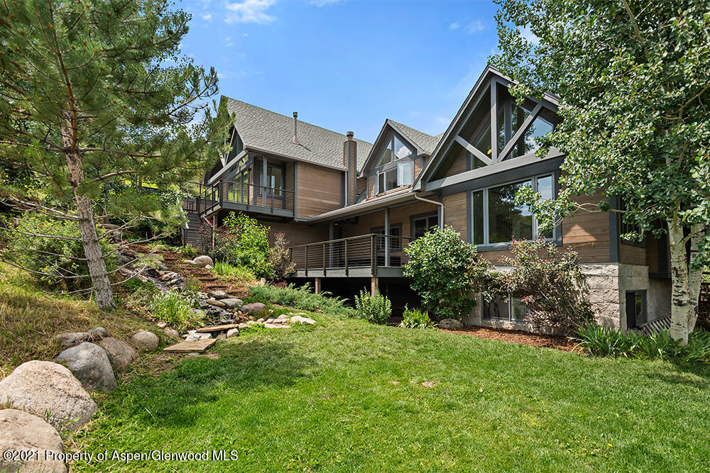 400 Medicine Bow Road Aspen, CO 81611 - Photo 45 of 58 a backyard of a house with lots of green space