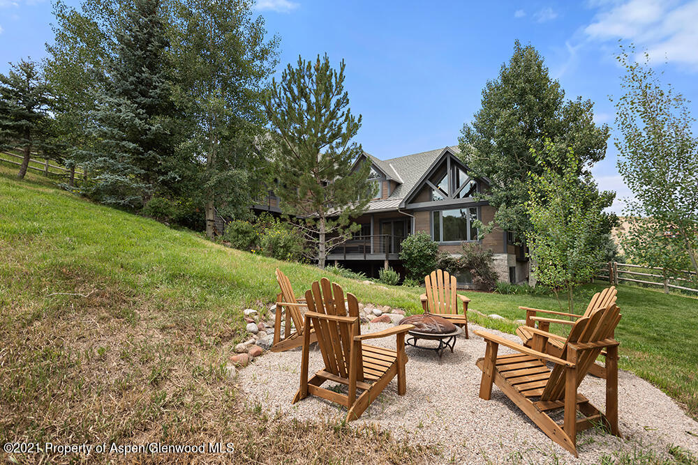 400 Medicine Bow Road Aspen, CO 81611 - Photo 47 of 58 a view of house with backyard and outdoor seating