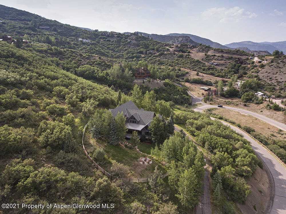 400 Medicine Bow Road Aspen, CO 81611 - Photo 54 of 58 a view of a lush green field with mountains in the background