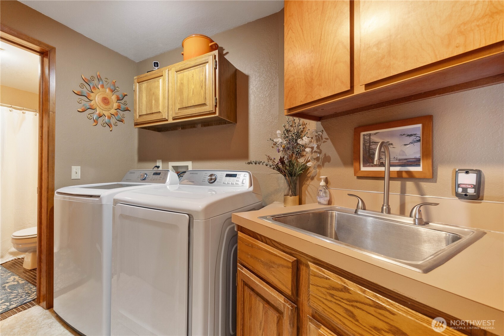 217 Riviera Drive Chelan, WA 98816 - Photo 17 of 38 a utility room with dryer and washer
