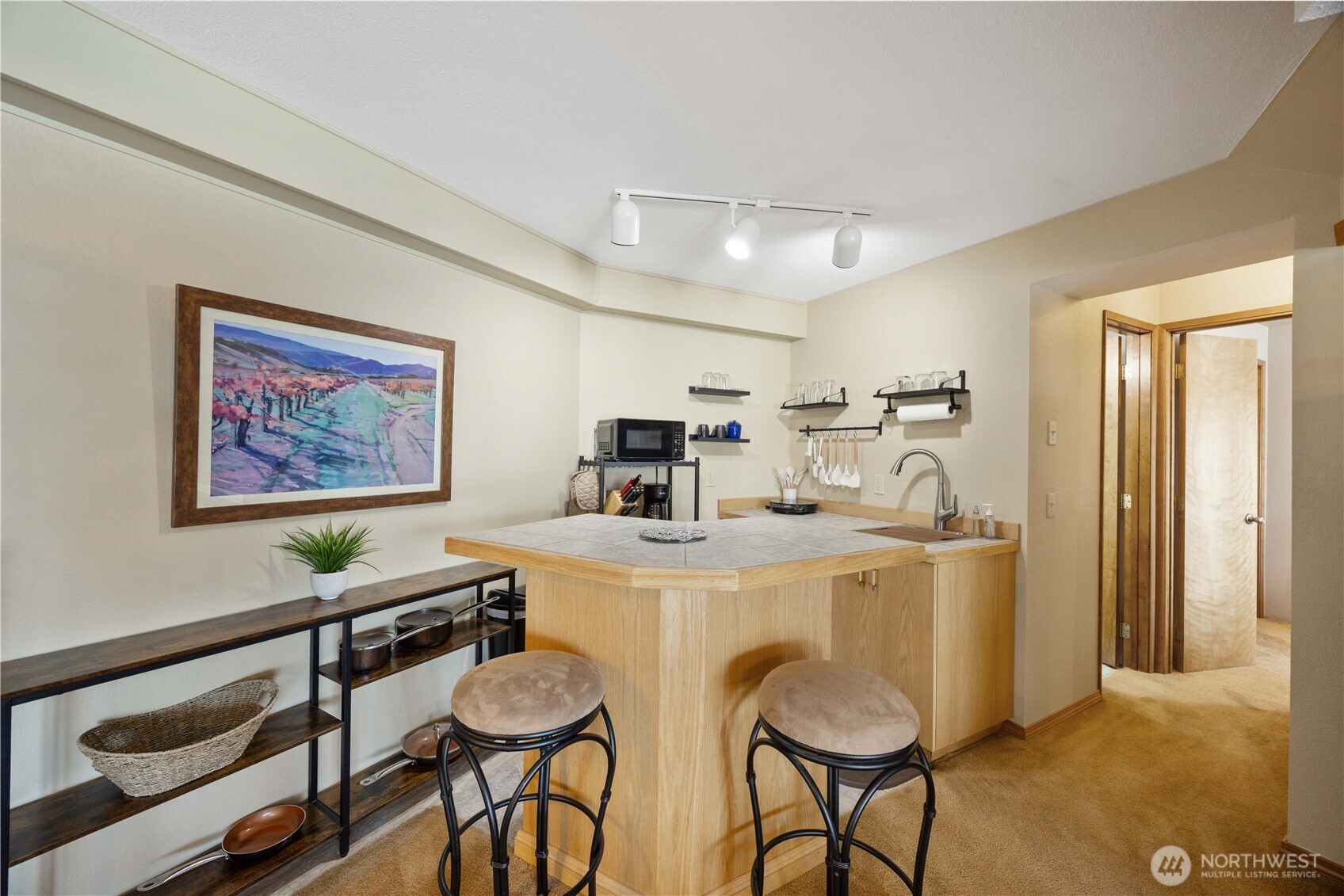 217 Riviera Drive Chelan, WA 98816 - Photo 20 of 38 a view of a dining room with furniture wooden floor and a chandelier