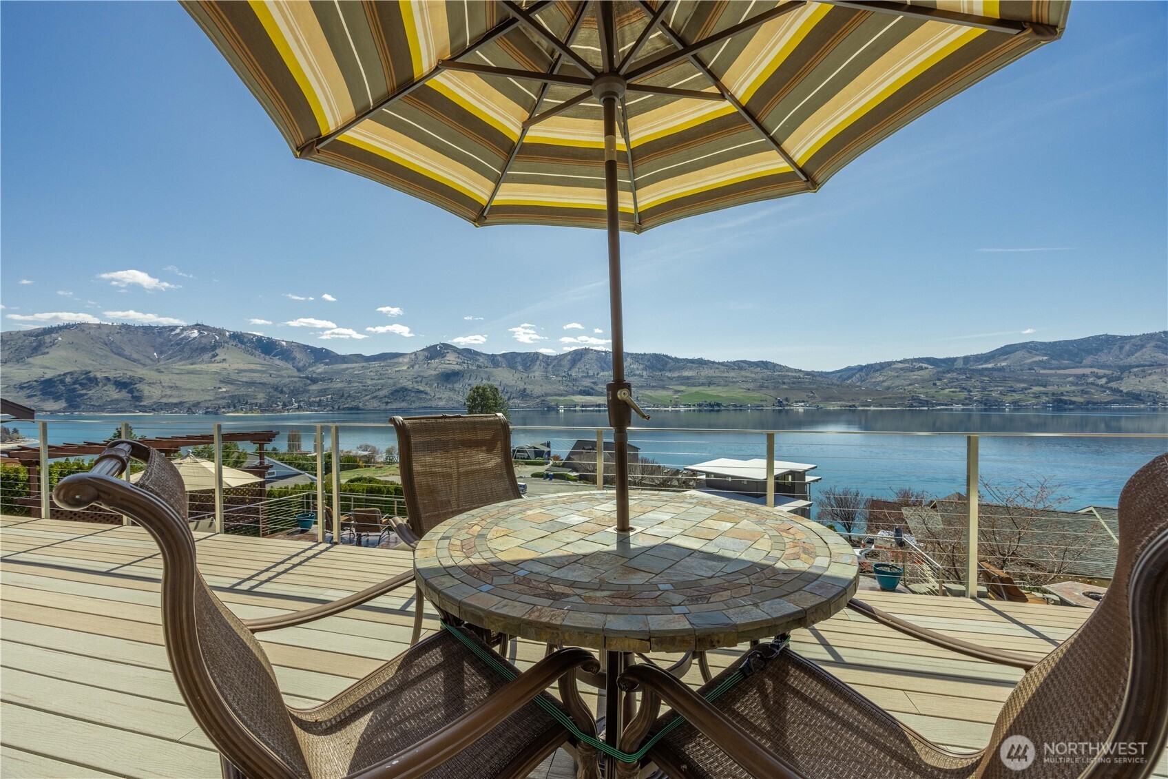 217 Riviera Drive Chelan, WA 98816 - Photo 25 of 38 a view of a roof deck with table and chairs