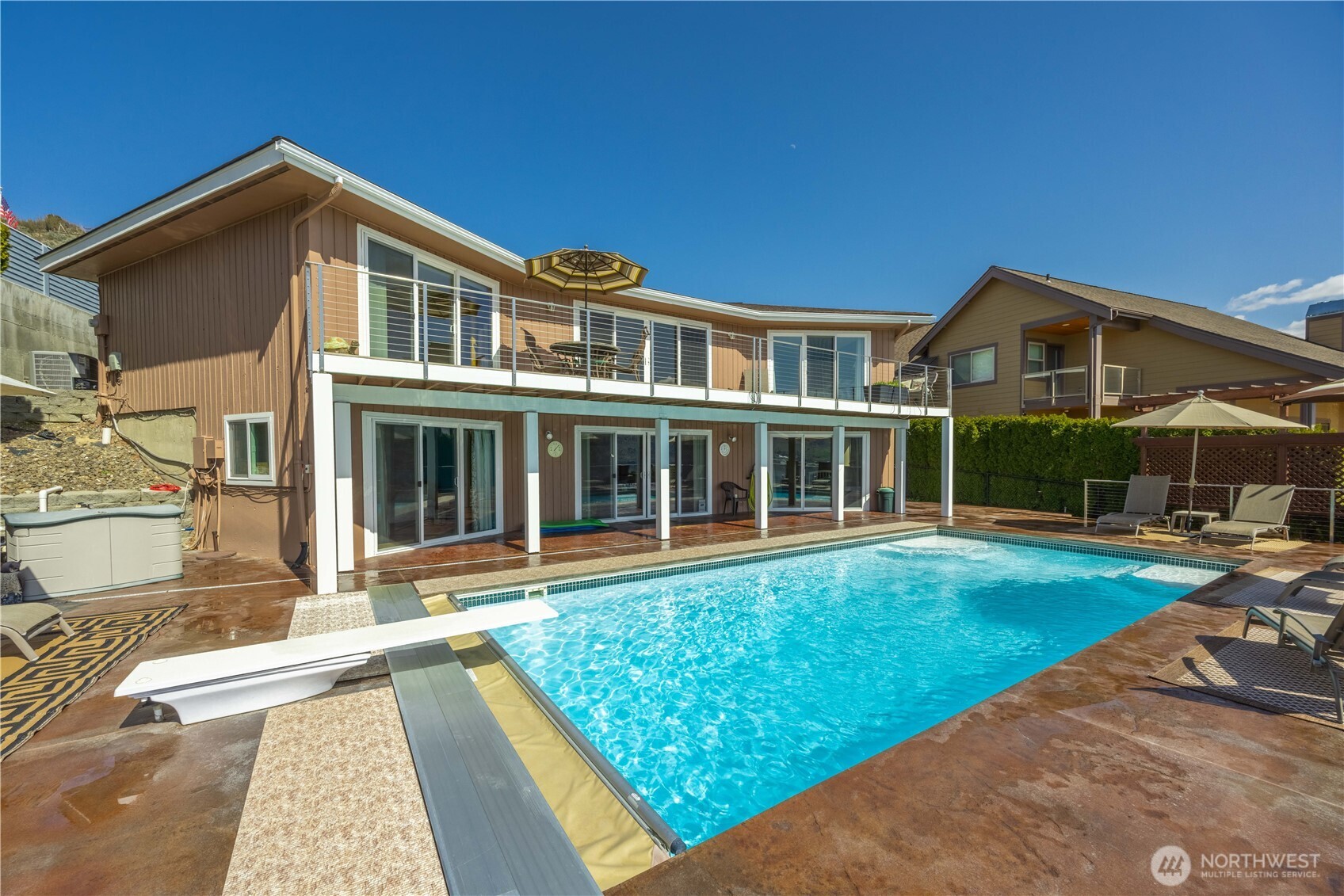 217 Riviera Drive Chelan, WA 98816 - Photo 3 of 38 a front view of a house with a yard