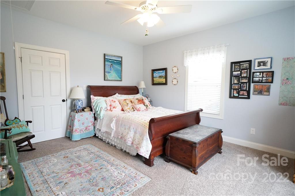 970 Lola Road Chester, SC 29706 - Photo 12 of 39 a bedroom with a bed couches and a flat tv screen
