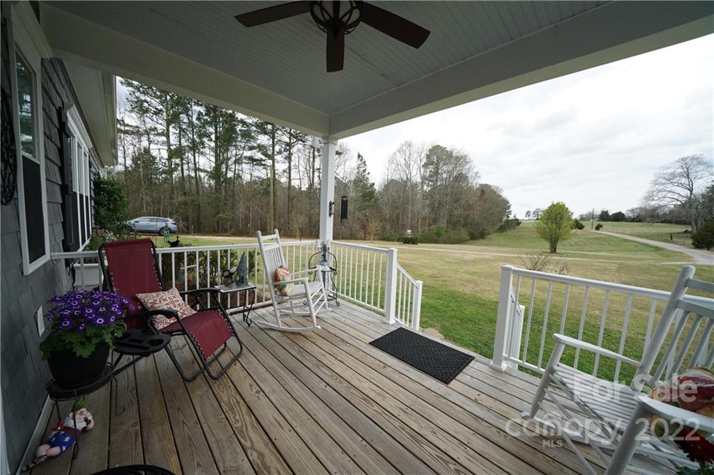 970 Lola Road Chester, SC 29706 - Photo 19 of 39 a view of a balcony with chairs and wooden floor