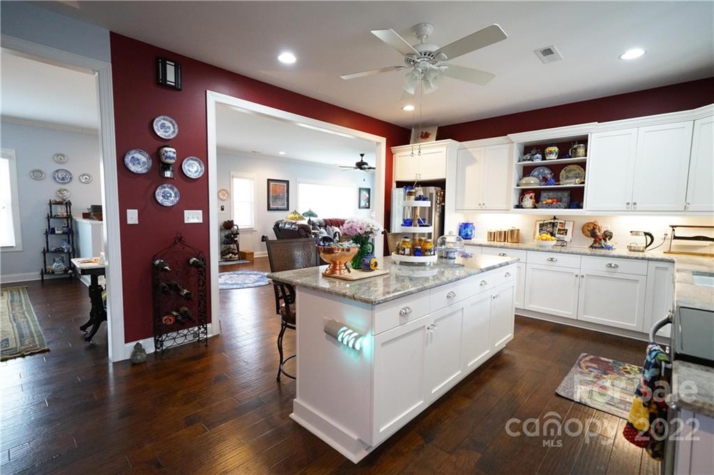 970 Lola Road Chester, SC 29706 - Photo 6 of 39 a open kitchen with sink cabinets and wooden floor