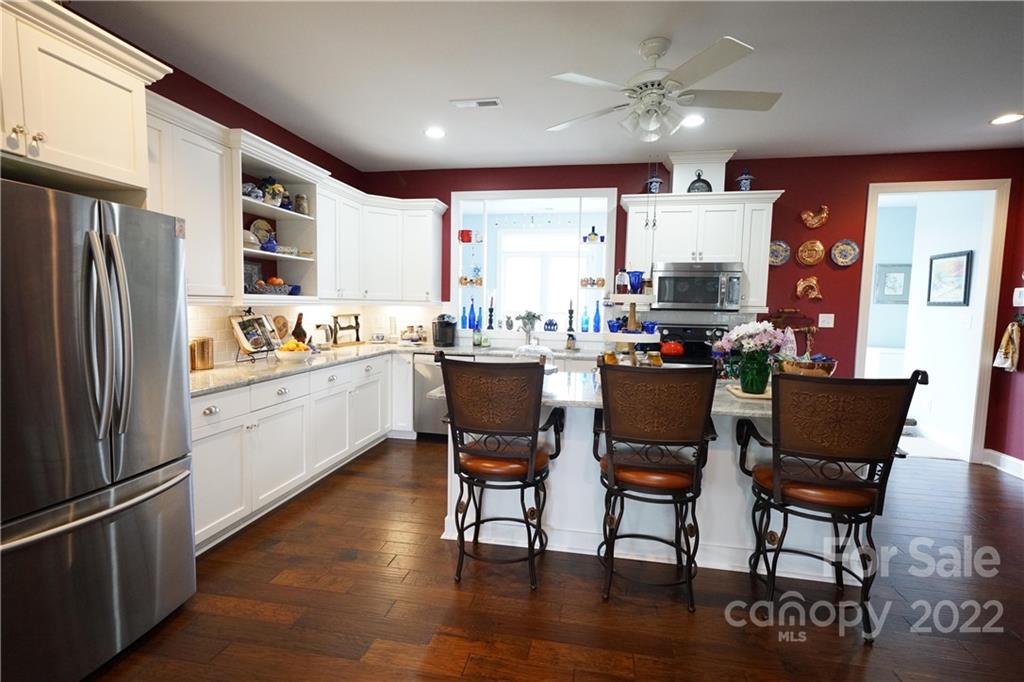 970 Lola Road Chester, SC 29706 - Photo 7 of 39 a kitchen with a sink stainless steel appliances and dining table