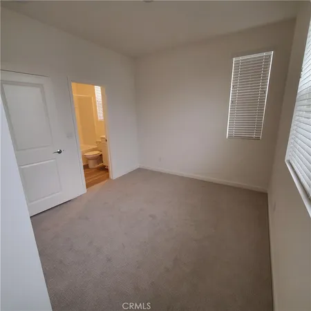 a bathroom with a toilet sink and a shower
