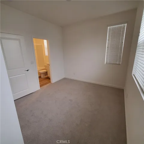 a bathroom with a toilet sink and a shower