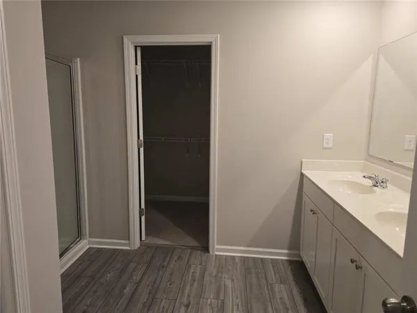a view of bathroom with a sink and mirror
