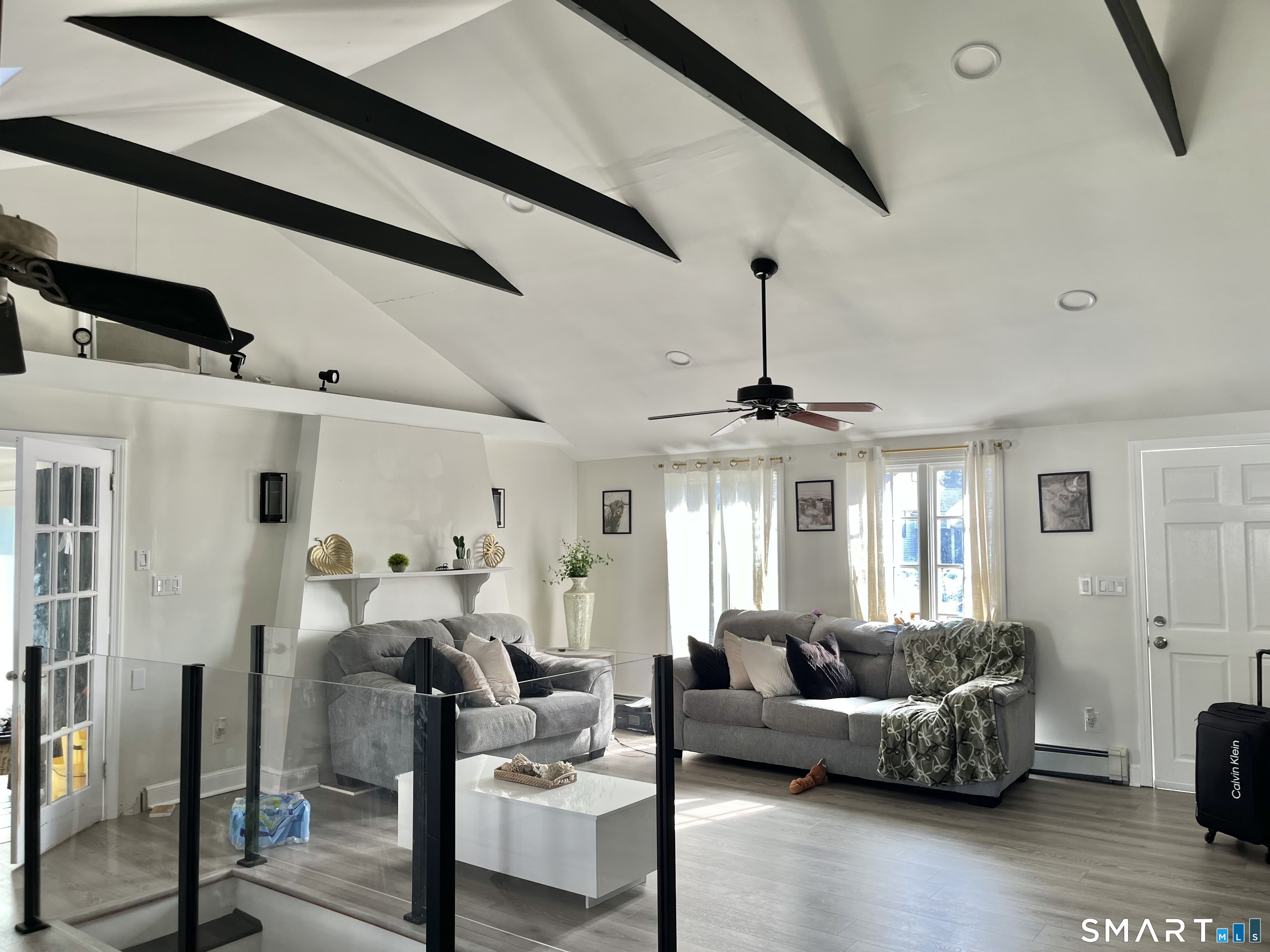 11 Marcy Road Bridgeport, CT 06606 - Photo 1 of 19 a living room with furniture and a chandelier