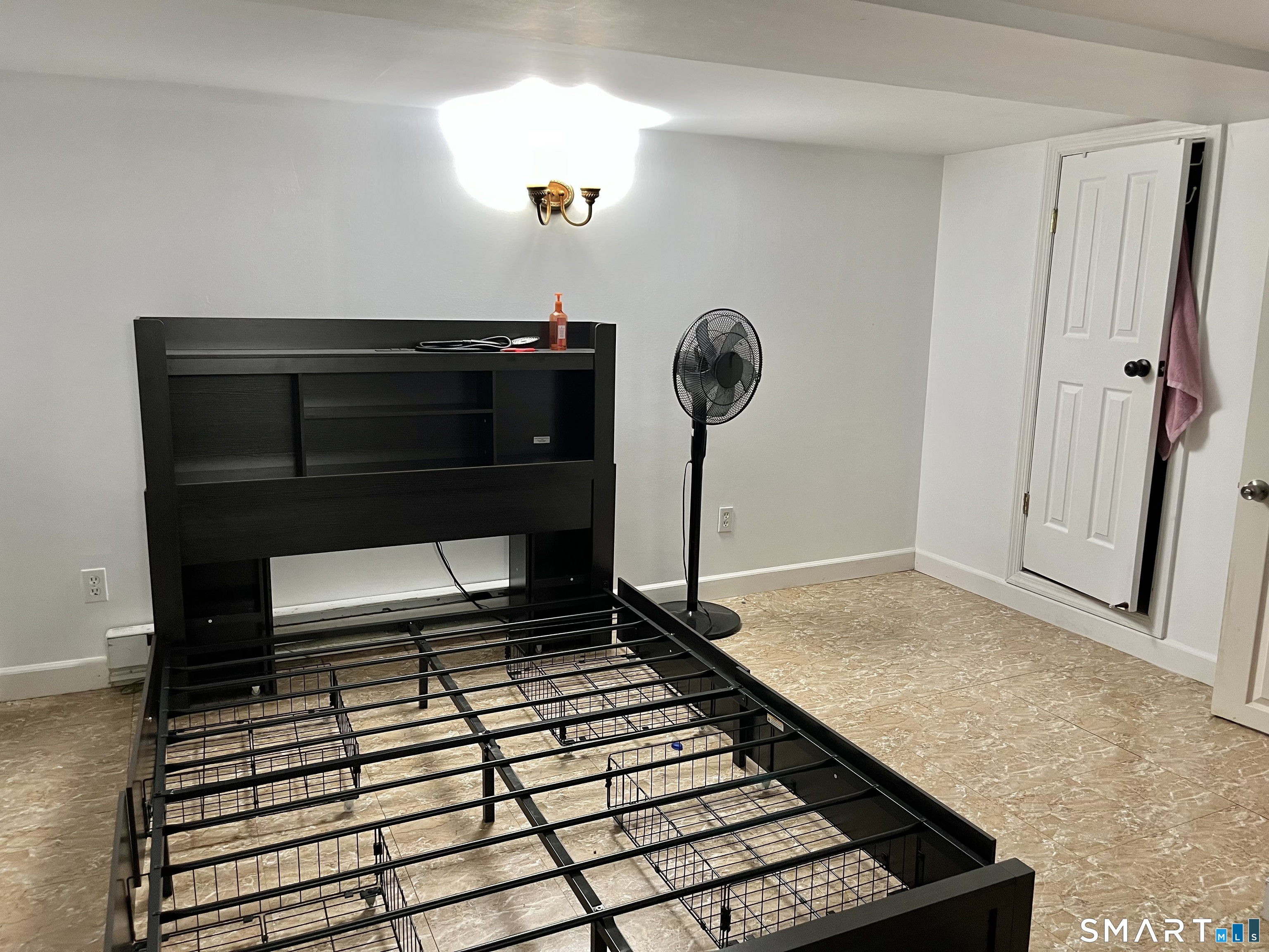 11 Marcy Road Bridgeport, CT 06606 - Photo 14 of 19 a living room with a black furniture and a rug