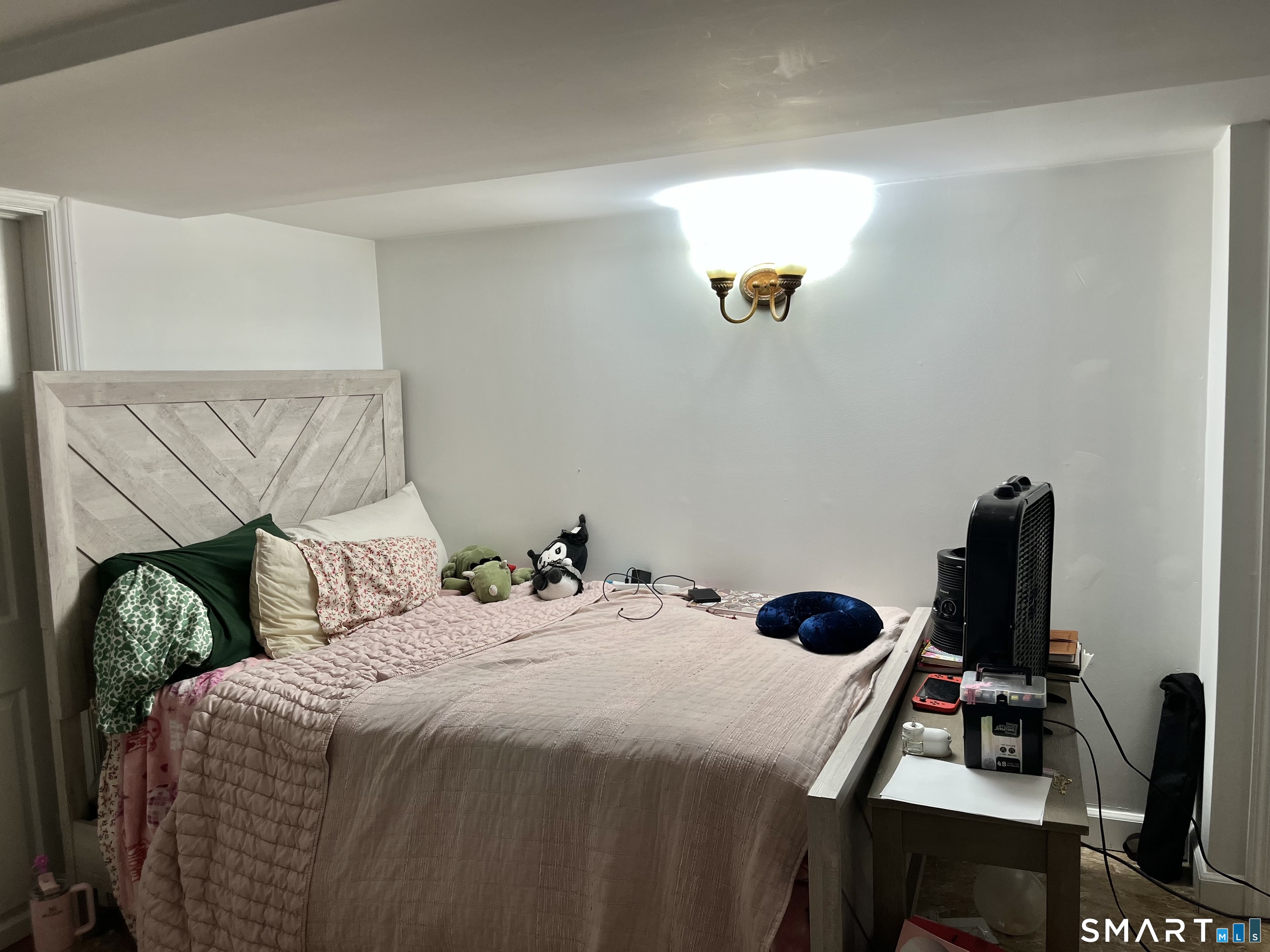 11 Marcy Road Bridgeport, CT 06606 - Photo 18 of 19 a bedroom with a bed and a window