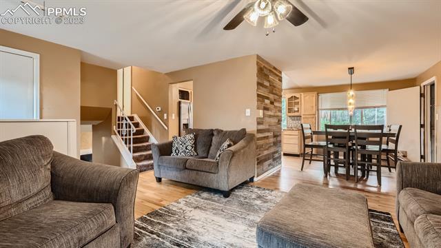1412 Wooten Road Colorado Springs, CO 80915 - Photo 6 of 32 Living room - kitchen - dining area - main/garage level