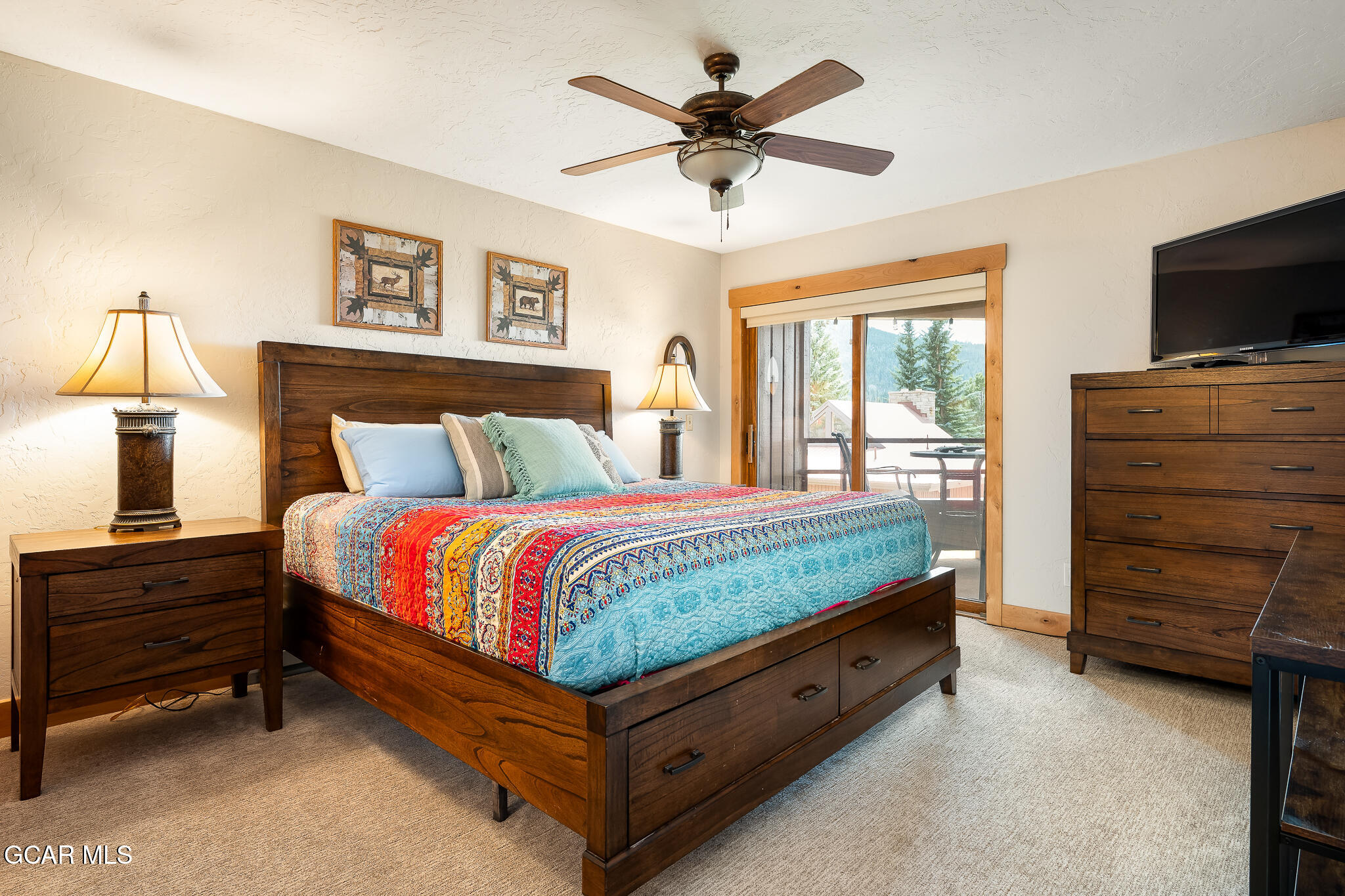 605 Lake Front Road, Unit W8 Grand Lake, CO 80447 - Photo 15 of 28 a bed room with a bed and a television