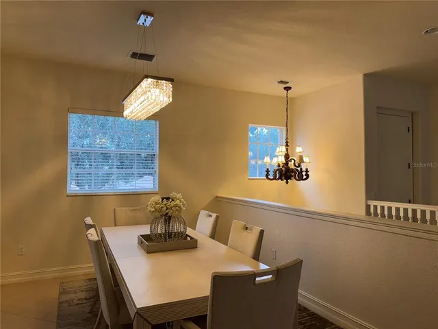 a view of a dining room with furniture