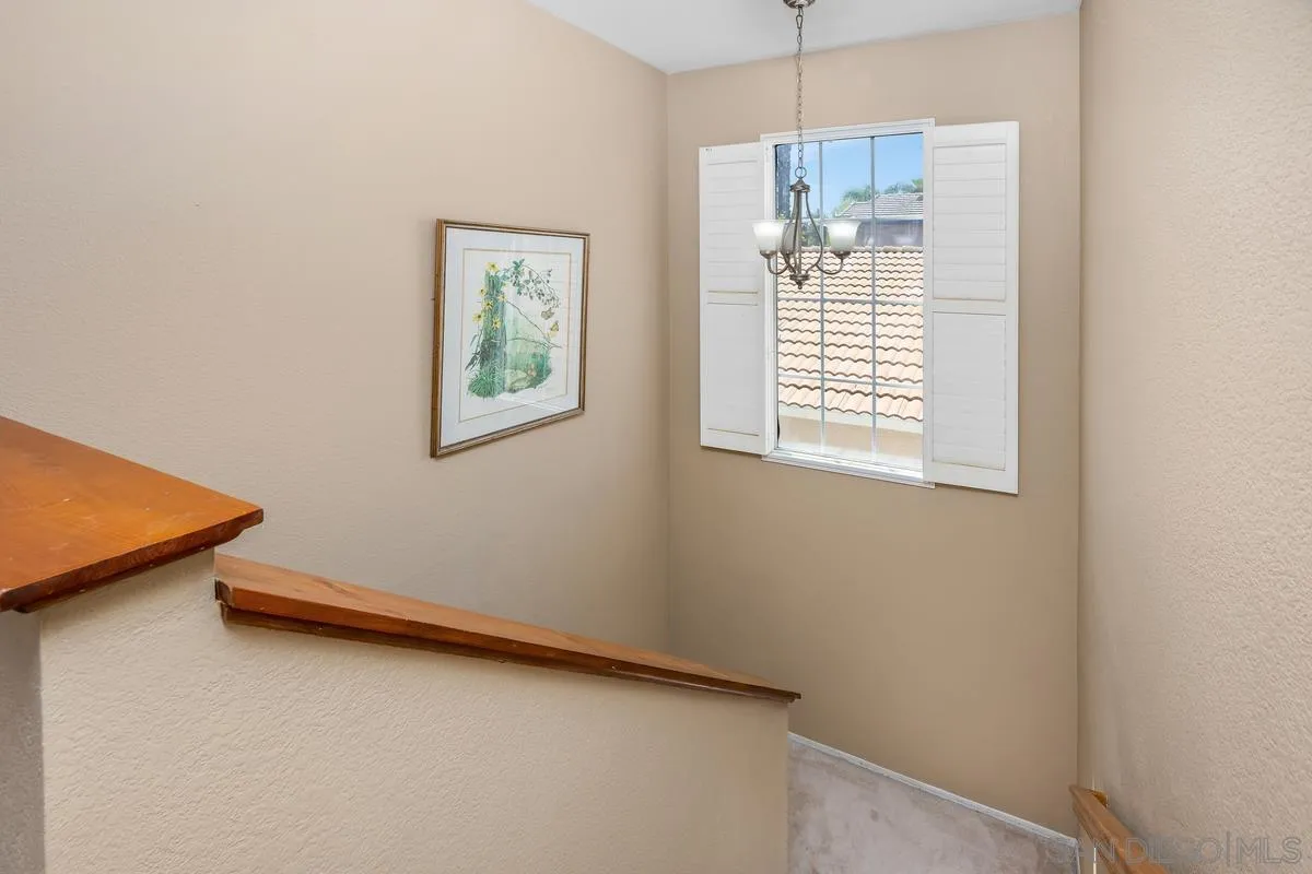 39537 Tischa Drive Temecula, CA 92591 - Photo 13 of 35 a view of hallway with window and a chandelier