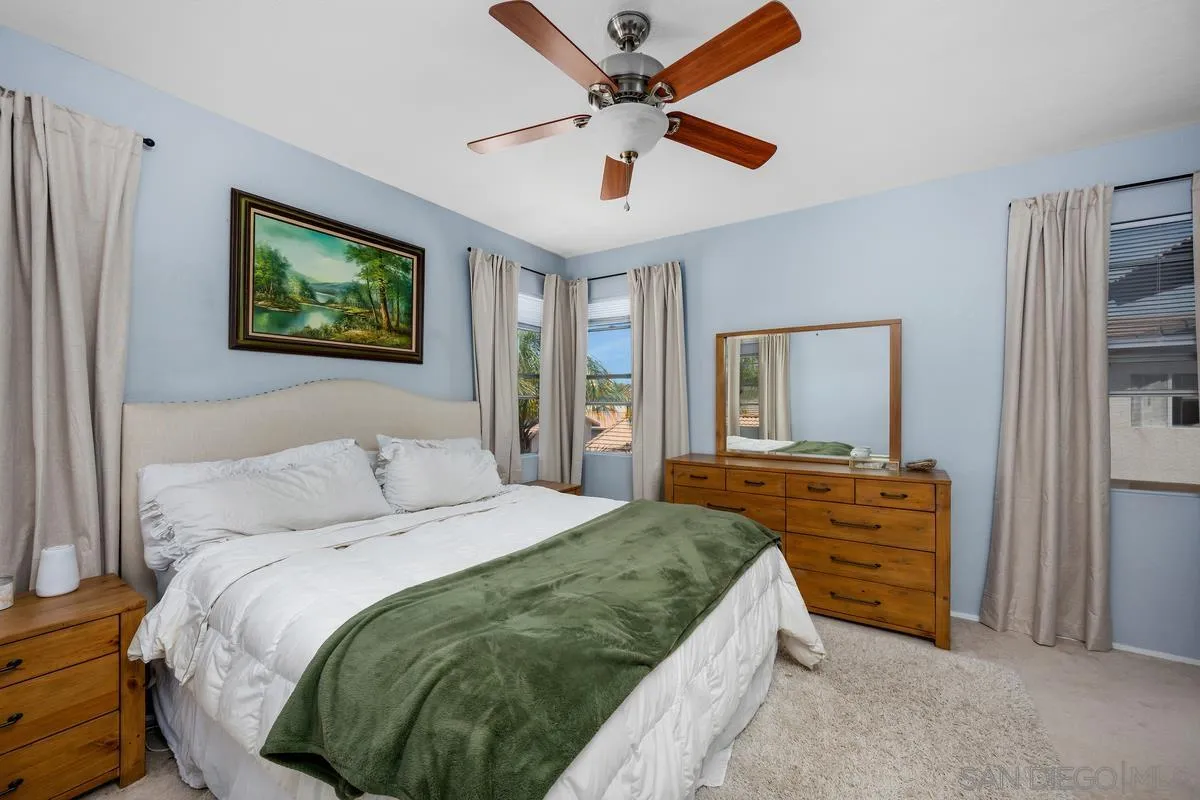 39537 Tischa Drive Temecula, CA 92591 - Photo 20 of 35 a bedroom with a bed and a chandelier