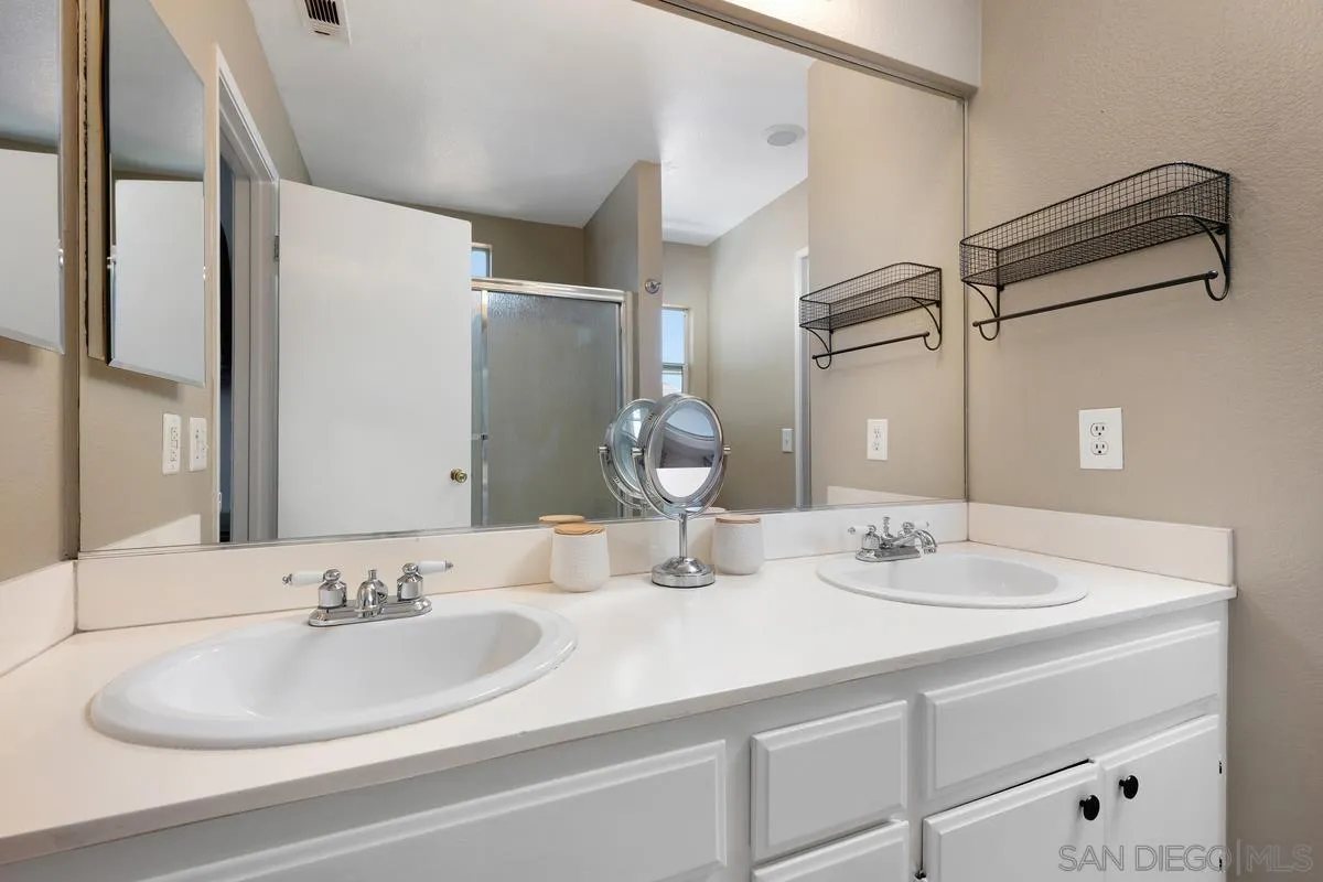 39537 Tischa Drive Temecula, CA 92591 - Photo 22 of 35 a bathroom with a sink and a mirror